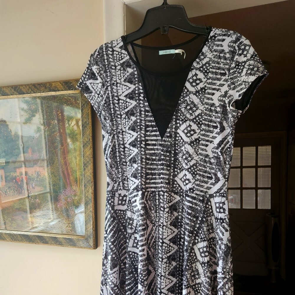 Very sexy airy for summer - black mesh in front & big piece in back stretchy